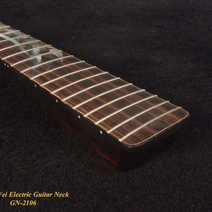 May include: Close-up of a guitar neck with silver frets and a dark wood fretboard. The text "Bruce Wei Electric Guitar Neck GN-2106" is visible at the bottom. The neck has a smooth, polished finish.