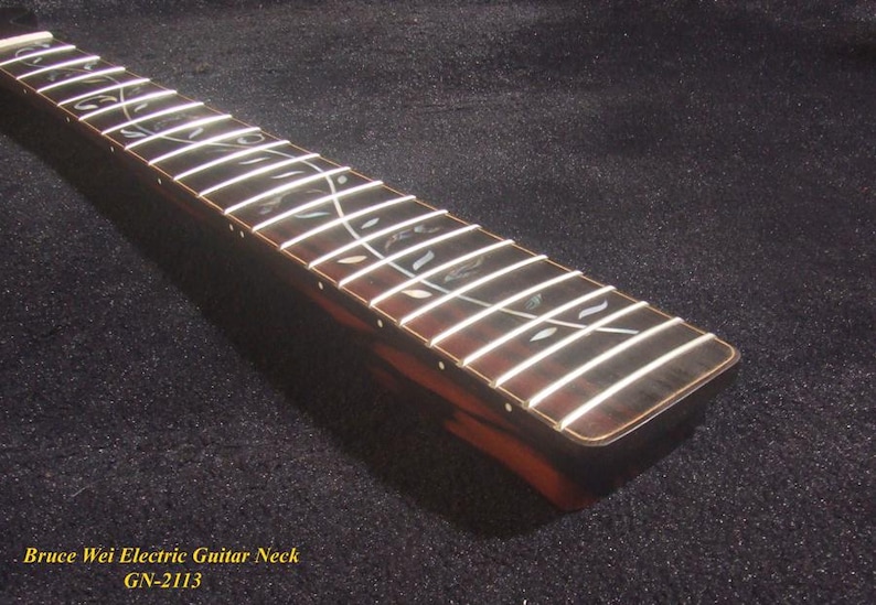 May include: A close-up shot of a guitar neck featuring white frets and decorative inlays. The neck is crafted from dark wood with a reddish-brown tone. The text "Bruce Wei Electric Guitar Neck GN-2113" is visible.