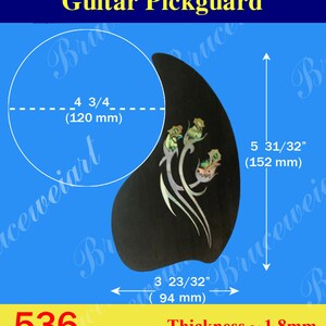 May include: Black guitar pickguard with a floral design, measuring 5 31/32 inches by 3 23/32 inches and 1.8 mm thick.