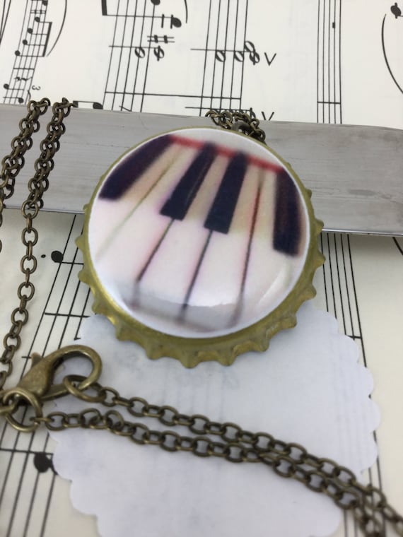 Items similar to NECKLACE Piano keyboard bottle cap necklace on Etsy