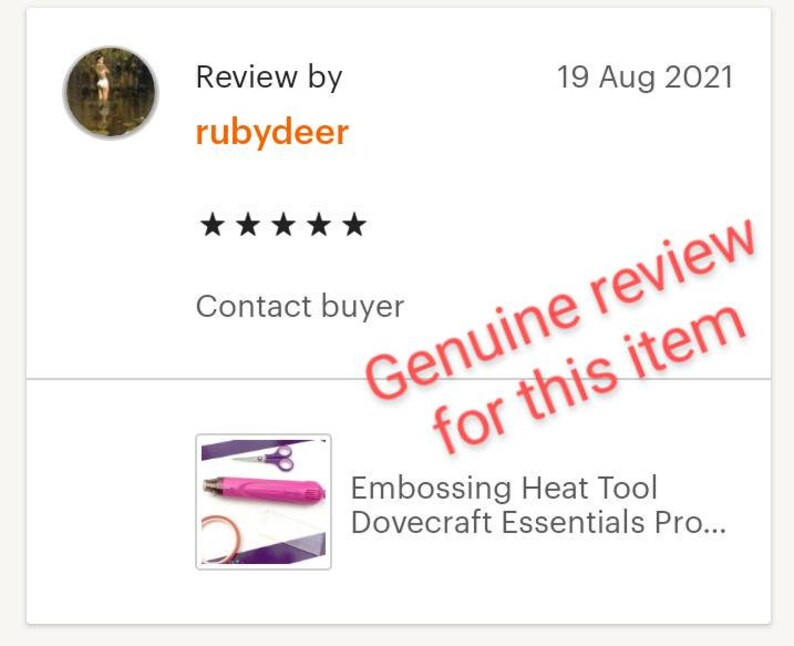 May include: A pink heat tool with a black handle and a silver tip. The tool is on a purple surface with a pair of silver scissors. The text "Embossing Heat Tool Dovecraft Essentials Pro..." is below the image.
