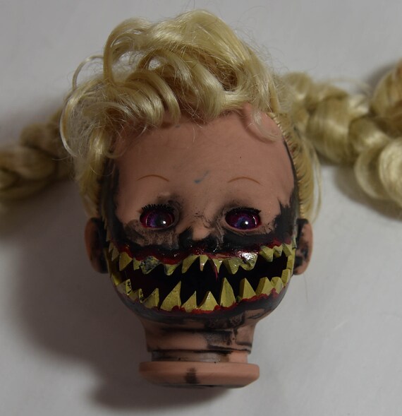 creepy teeth doll