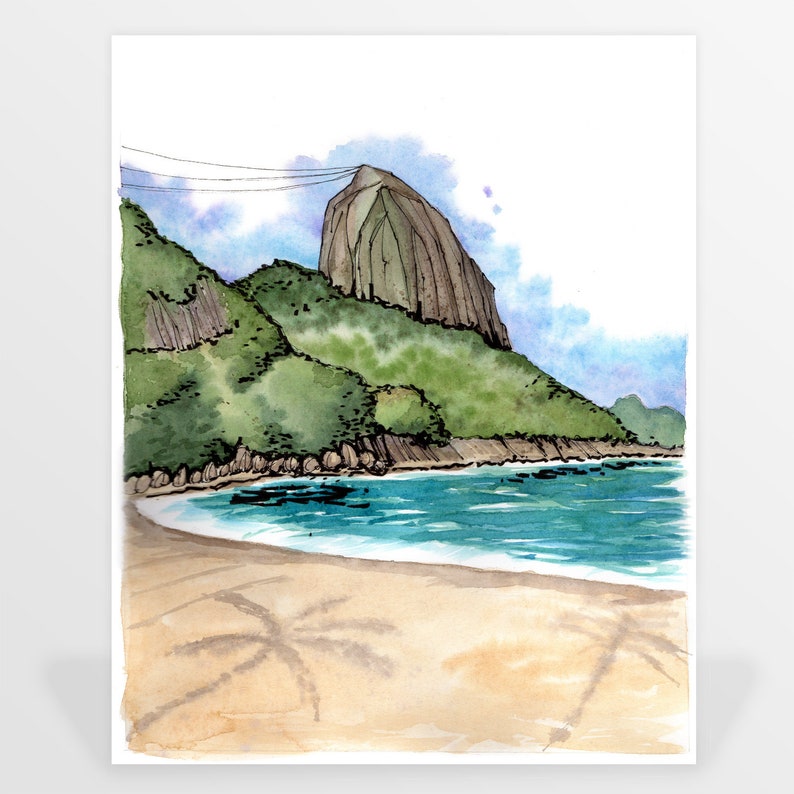 May include: A watercolor painting of a beach scene with a large, rocky mountain in the background. The beach is sandy and there is a blue ocean in the foreground. The sky is a light blue with some clouds.