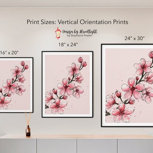 May include: Three framed prints of a pink cherry blossom branch on a pink background. The prints are in different sizes: 16 inches by 20 inches, 18 inches by 24 inches, and 24 inches by 30 inches.