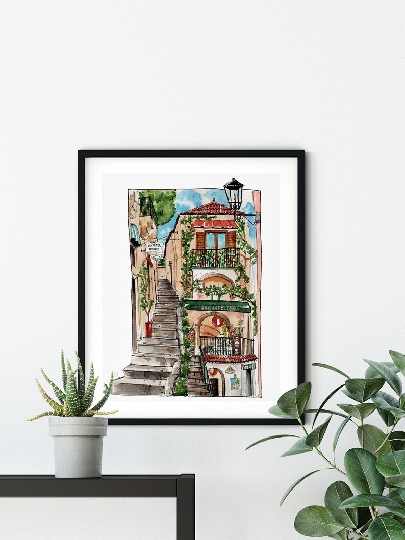 May include: Watercolor painting of a narrow street in a European city. The street is lined with buildings, and there are stairs leading up to a building with a balcony. The building has a green awning with the word "Ristorante" written on it. There is a street lamp on the right side of the image.