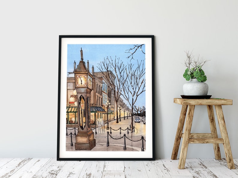 May include: Watercolour painting of a street scene with a clock tower in the foreground. The clock tower is brown with a white face and black hands. The street is lined with buildings and trees. The sky is blue and there are lights on the buildings.