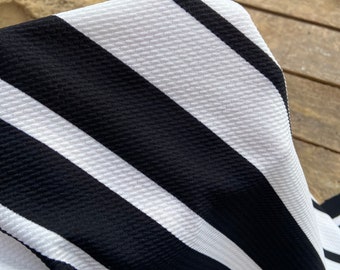 Liverpool black off white bullet Textured Stretchy knit ,  Crepe Knit Fabric, Black Stretch Knit Fabric by the yard