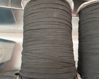 In STOCK 1/4 inch black braided elastic,  elastic for masks, black elastic, notions, swim elastic, skinny elastic, rubber elastic, scratches