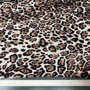 Leopard print double brushed polyester , leopard stretchy knit brushed polyester fabric, 60” wide, sold by the yard