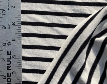 Woven knit black stripes on white Jersey knit polyester knit, black white stripe knit, 8oz medium light knit, woven knit.