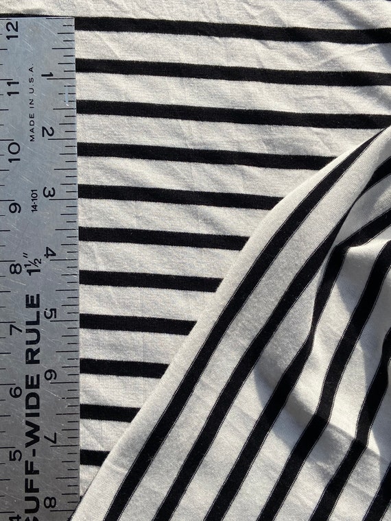 Woven knit black stripes on white Jersey knit polyester knit, black white stripe knit, 8oz medium light knit, woven knit.