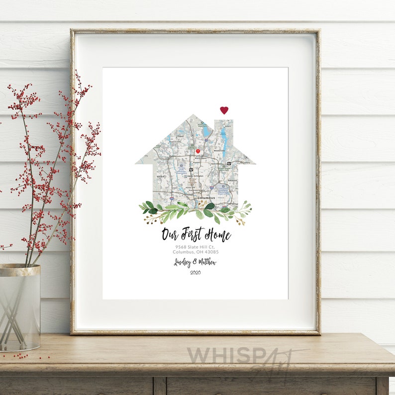 May include: A printable art print featuring a house-shaped map of a neighborhood with a red heart marking the location. The text "Our First Home" is below the map, along with an address, names, and the year 2020.