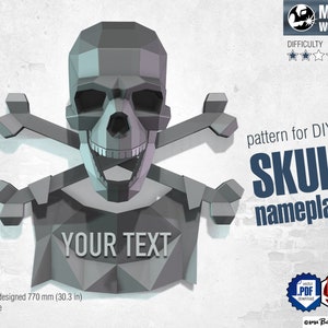 May include: A gray metal skull and crossbones design with a banner that says "YOUR TEXT". The design is a pattern for a DIY skull nameplate. The design is 30.3 inches tall and is scalable.