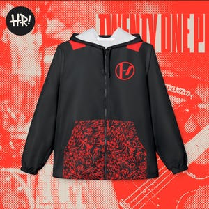 May include: Black zip-up hooded jacket with red accents and a white interior. The jacket features a red logo on the chest and a red and black patterned design on the pocket. The words "TWENTY ONE" are printed in red.
