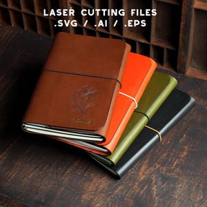 May include: Four leather journals in brown, orange, olive green, and black. The brown journal features a floral design and the word "Zareena". The text "LASER CUTTING FILES .SVG / .AI / .EPS" is at the top. The journals are bound with elastic.