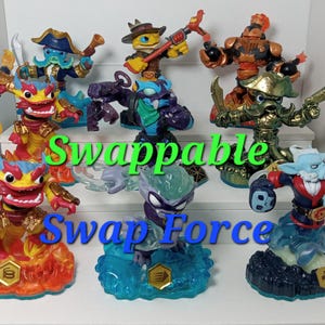 May include: A collection of eight Swap Force Skylanders figures. The figures are all different colors and have different weapons and accessories. The figures are standing on their bases, which are also different colors. The text "Swappable Swap Force" is printed on the bottom of the image.
