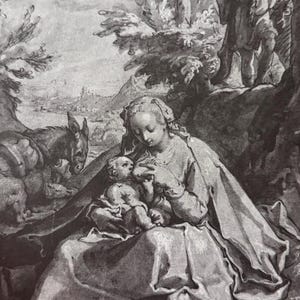 May include: A black and white print depicting a seated woman breastfeeding a baby, with a donkey and a man in the background. The scene is set outdoors with trees and a distant cityscape. The artwork is signed in the lower right corner.