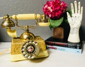 antique style rotary phone emobossed gold body midcentury