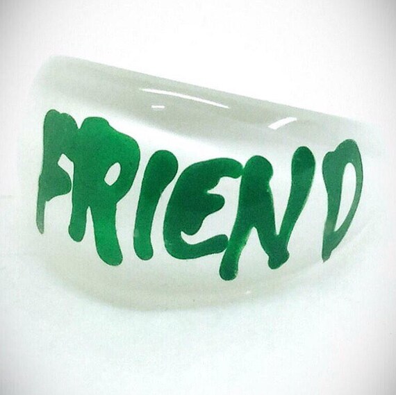 vintage lucite friend ring green writing white bac