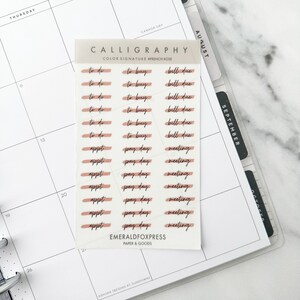 May include: A sheet of stickers with a peach color background and black calligraphy text. The stickers are for a planner or journal and include phrases like "to do", "to buy", "bill due", "appt", and "pay day".
