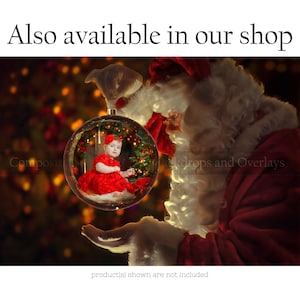 May include: Santa Claus holds a clear glass Christmas ornament with a young girl wearing a red dress inside. The ornament is decorated with a red bow and a gold ribbon. The background is a blurry image of Christmas lights.