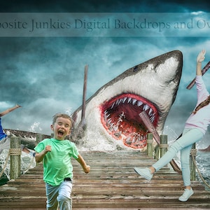 May include: Three children run away from a giant shark with its mouth open, on a wooden pier over a stormy sea. The shark is partially submerged in the water, with its tail and fins visible. The children are wearing casual clothing and look scared.