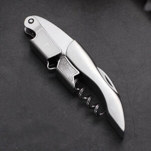 a knife shaped like a pocket knife on a table