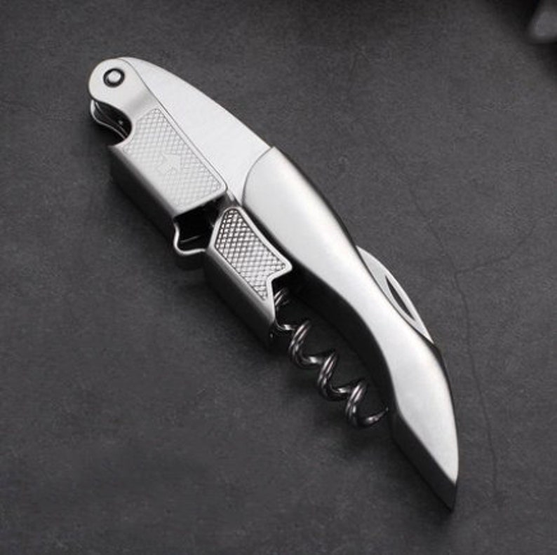 a knife shaped like a pocket knife on a table