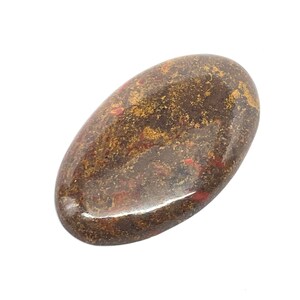 May include: A smooth, oval-shaped, polished stone with a brown and red marbled pattern.