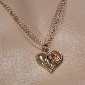 Vintage, Heart Pendant with a Ruby Rhinestone, Gold Plated with a Flower Pattern. (Unsigned). 18&quot; Long Gold-Plated Chain Included. Like New!