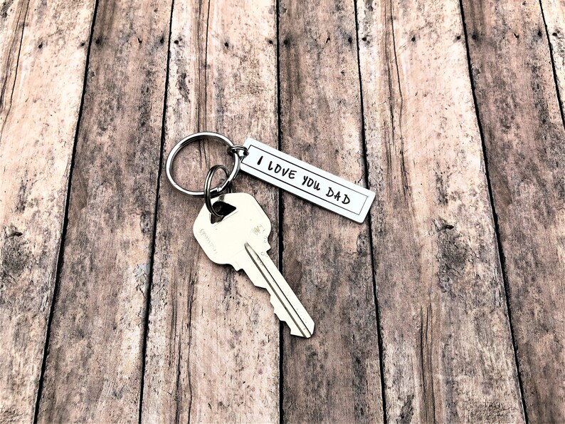 May include: Silver keyring with a key and a tag that says "I love you Dad".