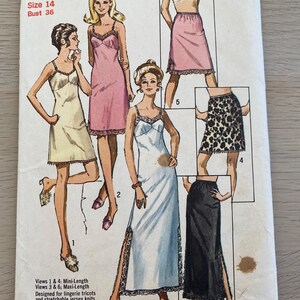 May include: A Simplicity 9115 sewing pattern envelope for lingerie, size 14, bust 36. The cover features illustrations of six garment variations including mini and maxi length slips and skirts in solid colours and a leopard print with lace trim.