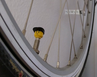 Tapones de válvulas para bicicletas fabricados con piezas de personajes LEGO®; compatibles con válvulas Presta/Sclaverand y Dunlop (1 juego en negro)
