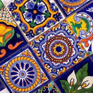 May include: A collection of colorful, hand-painted ceramic tiles with intricate floral and geometric designs. The tiles feature a variety of colors, including blue, yellow, green, red, and white.