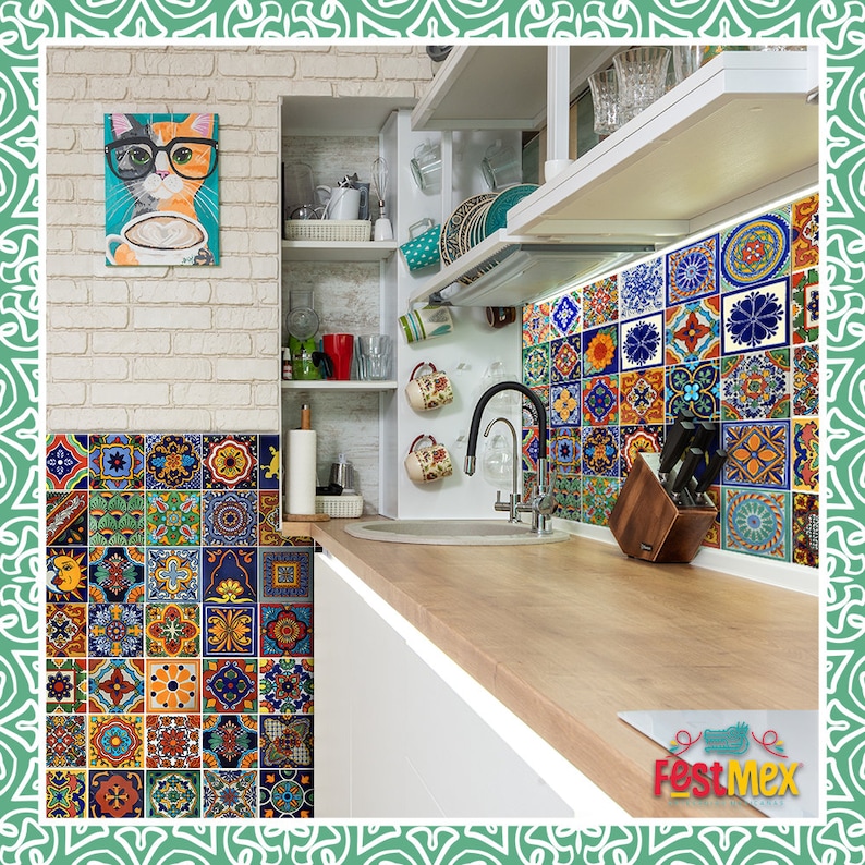 May include: A white kitchen with a sink and a wooden countertop. The backsplash is made of colorful, patterned tiles. There is a cat wearing glasses in a framed picture on the wall.