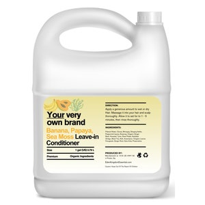 May include: A gallon jug of "Your very own brand" Banana, Papaya, Sea Moss Leave-in Conditioner. The label is yellow with a papaya, banana, and seaweed illustration. The label also includes the size, 1 gallon (3.78 L), and states that the product is made with organic ingredients.