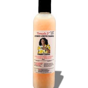 May include: A clear plastic bottle with a black cap and a peach-colored liquid. The bottle is labeled "Formula D Extended Lengths Shampoo" and features a woman's face with the text "Eden Kingdom Essential" and "Makes hair visibly thicker, longer, & stronger!"
