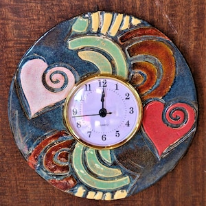 Fabulous, fun, ceramic, handmade wall-hanging clocks