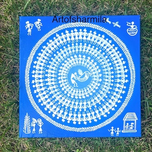 May include: A blue canvas painting with white figures in a circular pattern. The figures are stylized and represent people dancing. The painting has a white border and the text "Artofsarmilla" in the top center.