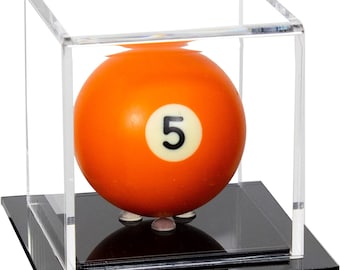 May include: A bright orange billiard ball with the number five printed in black on a white circular background, enclosed within a clear acrylic cube display case that sits on a solid black square base to showcase the sports collectible.