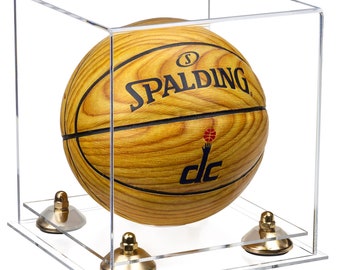 May include: A basketball with a wood grain pattern is displayed in a clear acrylic case with a gold base. The basketball has the Spalding logo and the letters "DC" on it.