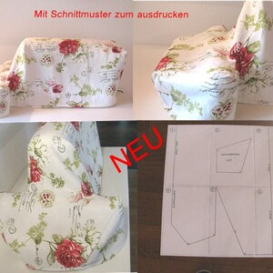 May include: A white sewing machine cover with a floral pattern featuring red roses and green leaves. The cover is shown in different positions, and a sewing pattern is included. The pattern is labeled with numbers and includes a note that says "Mit  Schnittmuster zum ausdrucken" which translates to "With pattern for printing".