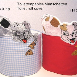 May include: Two toilet roll covers with embroidered dog designs. The cover on the left is blue and white gingham with a grey dog. The cover on the right is red with a white dog. The text "ITH 13 X 18" is above the blue cover and "ITH 5 X 7" is above the red cover.
