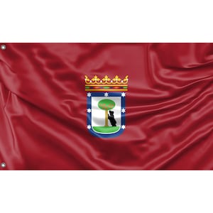 May include: A red flag with a coat of arms featuring a green tree with red fruit and a black bear standing on its hind legs. The coat of arms is surrounded by a blue border with white stars and a gold crown.