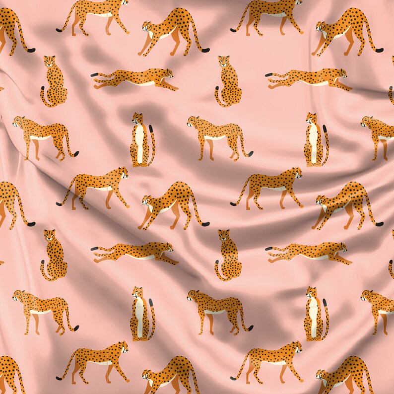 May include: A pink fabric background with a repeating pattern of brown and black cheetahs in various poses. The cheetahs are stylized and have a flat design.