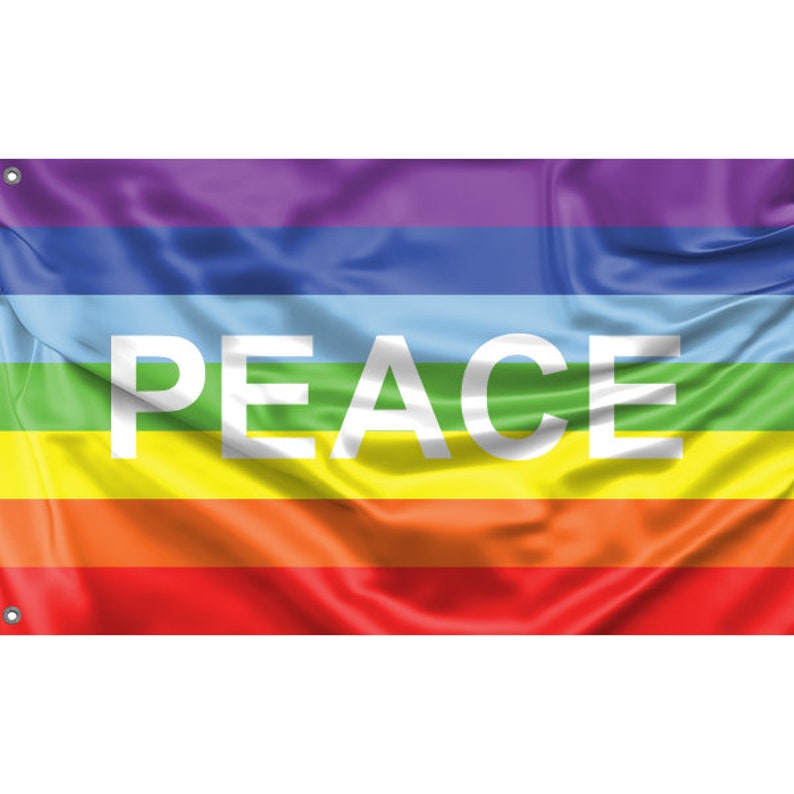 May include: A rainbow peace flag with the word "PEACE" in white letters.
