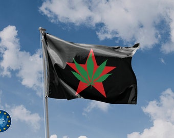 May include: A black flag with a red five-pointed star featuring a green marijuana leaf in the center. The flag is waving in the wind against a blue sky with white clouds.
