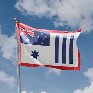 May include: A flag with a red, white and blue design. The flag has a blue field with five white stars, a red field with a Union Jack in the top left corner, and three vertical blue stripes on the right side. The flag is waving in the wind against a blue sky with white clouds.