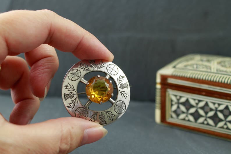 Scottish thistle brooch with citrine sterling silver hallmarked Glasgow Robert Allison 1950s mid century traditional plaid pin Scotland