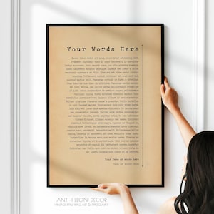 May include: A rectangular framed print with a tan, parchment-style background and black typewriter-style text. The header reads Your Words Here, followed by a block of Latin placeholder text, and footer lines for Your Name or words here and Date or Words Here.